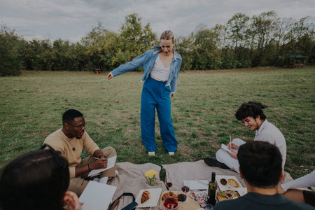Group enjoying an outdoor picnic with games and laughter