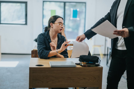 High school student engaging with teacher during class discussionの写真素材