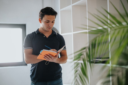 Focused student taking notes in a modern environment