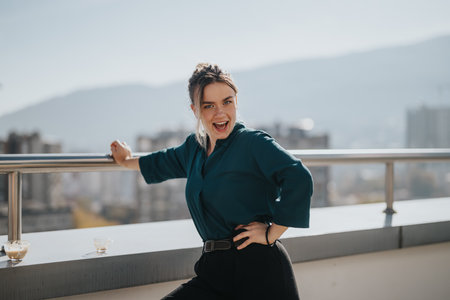 Happy business worker enjoying break on an office rooftop terraceの写真素材
