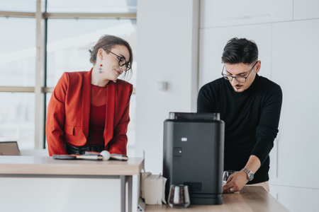 Business people interacting in modern office kitchen area