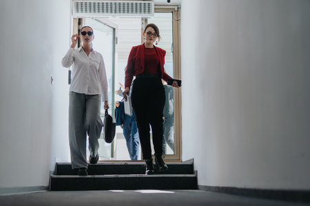 Two business people confidently stepping onto a balcony, exuding professionalism and style.