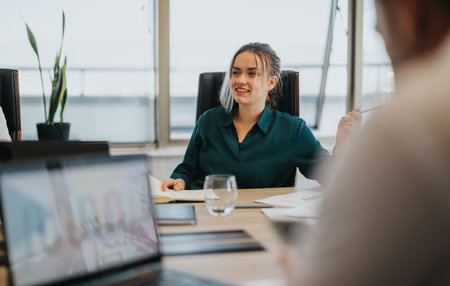 Confident businesswoman leading a meeting in a modern office setting
