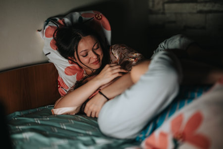 Woman enjoying a relaxing moment in comfortable bed at home