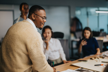 Diverse business team collaborating in modern office settingの写真素材