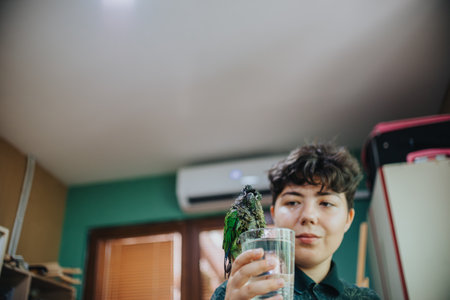 Young girl interacting with a parrot in a home environment
