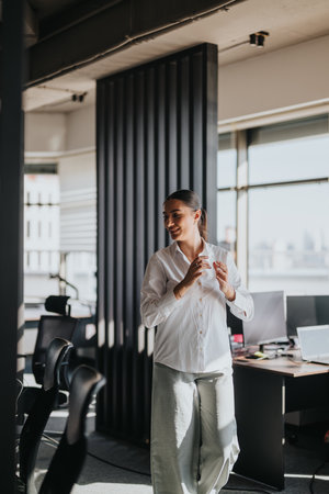 Confident business worker in a modern office settingの写真素材