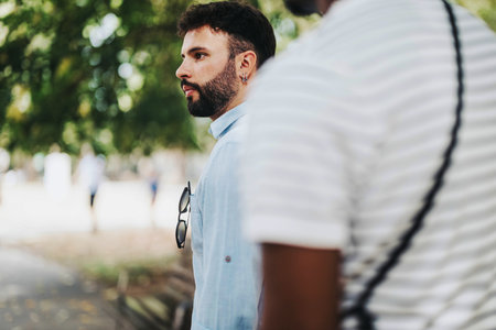 Casual business discussion in outdoor park setting