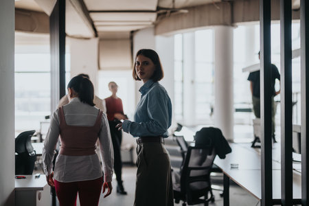 Multicultural business people collaborating in modern open office space
