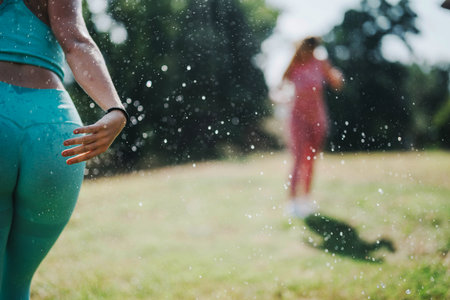 Young friends enjoying a sunny outdoor exercise sessionの写真素材