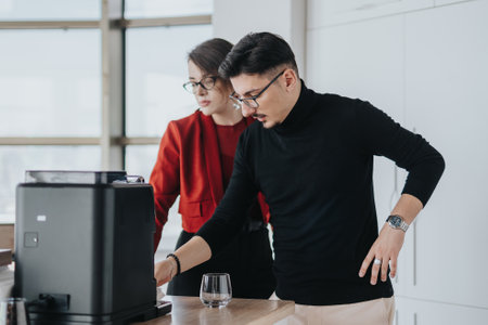 Business employees collaborating in modern office kitchen