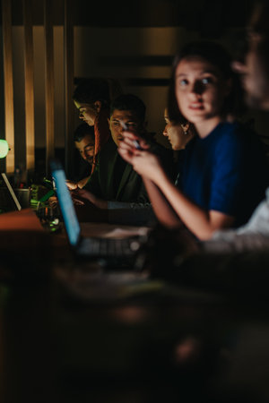 Business team collaborating at night to meet important project deadlineの写真素材