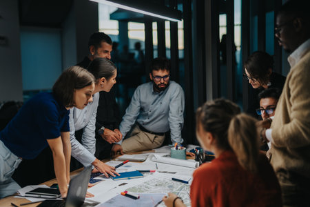 Colleagues collaborates on a business project, brainstorming ideas and analyzing solutions during an...