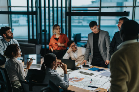 Diverse team brainstorming innovative ideas in modern office spaceの写真素材