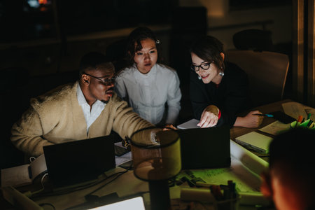 Business colleagues collaborating on a project during a late night work session
