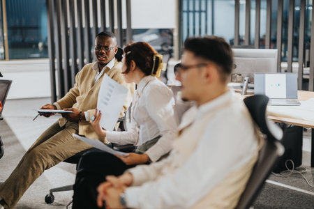A group of business professionals interacting and sharing ideas during a corporate meeting.