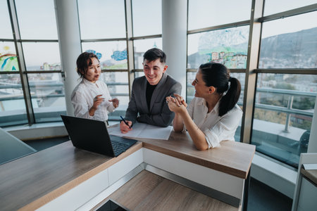 Business professionals discussing a project in a modern office setting
