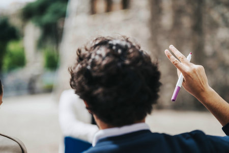 High school students collaborating outdoors with teachers guidanceの写真素材
