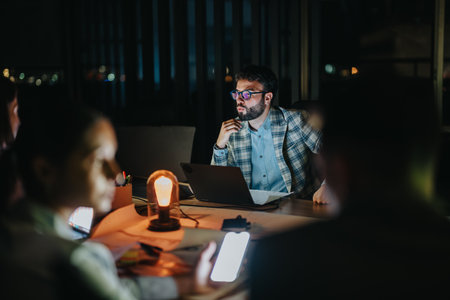Business coworkers collaborating during a late night office meeting session