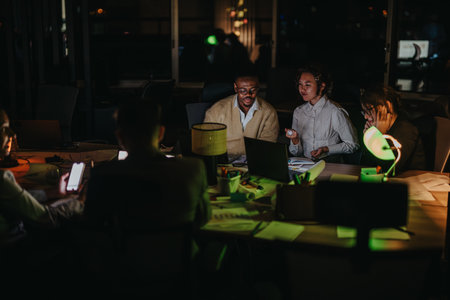 A diverse group of professionals engaging in discussion and strategic planning in a dimly lit...