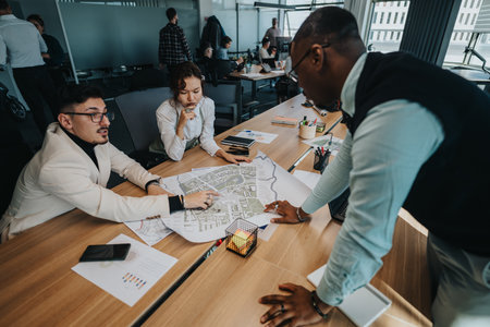 Business team discussing project plans in a modern office setting
