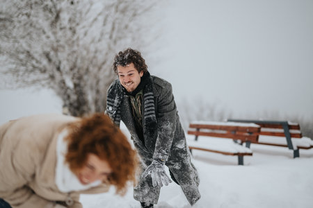 Friends Enjoying a Playful Snow Day in a Winter Parkの写真素材