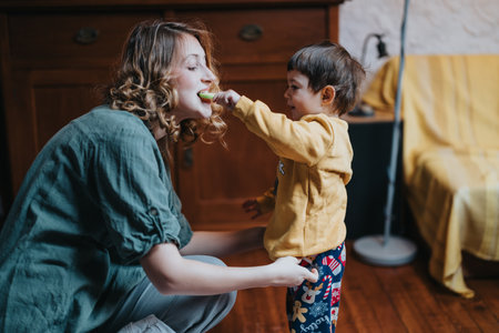 Mother and child sharing a playful moment in a cozy home setting