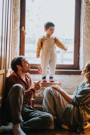 Happy family spending quality time together in a cozy home environmentの写真素材