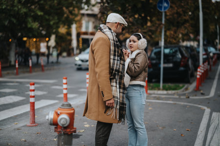 Young couple sharing a moment outdoors in an urban settingの写真素材