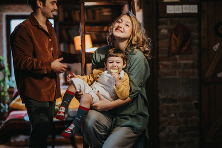 Happy family enjoying quality time together in cozy home settingの写真素材