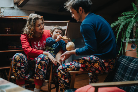 Family Enjoying Quality Time Together During Festive Holidays in Their Cozy Homeの写真素材