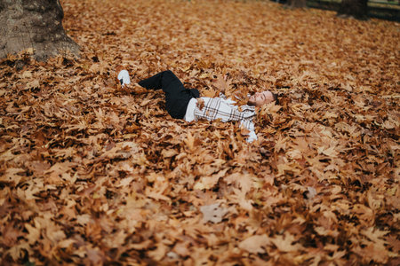 Relaxing in Autumn Leaves in a Picturesque Park Setting