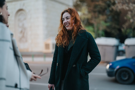Outdoor meeting with happy businesswomen in a casual urban setting