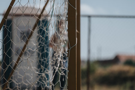 Close-up view of a soccer goal net at an outdoor fieldの写真素材