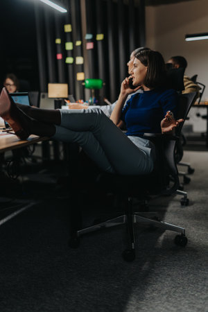 Business team working late at night in a modern office settingの写真素材