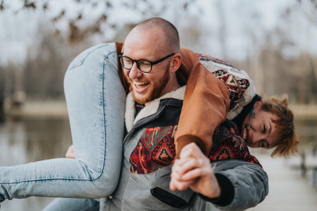 Happy couple enjoying playful moments in a serene nature setting