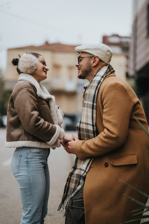 Happy couple enjoying a cheerful moment together in urban outdoor settingの写真素材