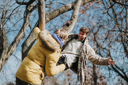 Two friends enjoying a playful moment outdoors on a sunny dayの写真素材