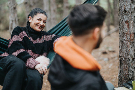 Young friends enjoying a casual winter picnic in a forest setting
