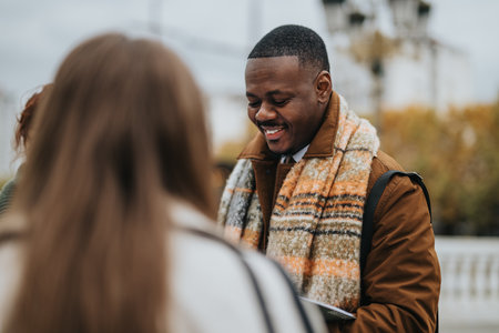 Group of friends enjoying a casual day outdoors with warm attireの写真素材