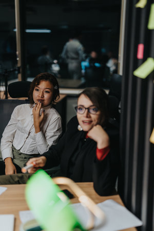 People engaged in a late night office work session
