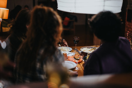 Friends enjoying dinner together in a cozy and inviting atmosphere
