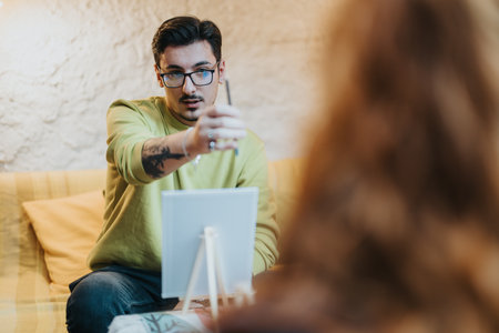 Focused Artist Engaging With a Subject During a Creative Interactive Sessionの写真素材