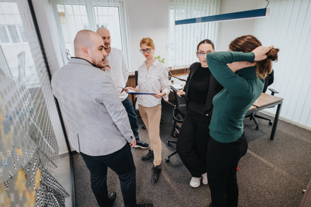 Group of business colleagues collaborating in an office spaceの写真素材