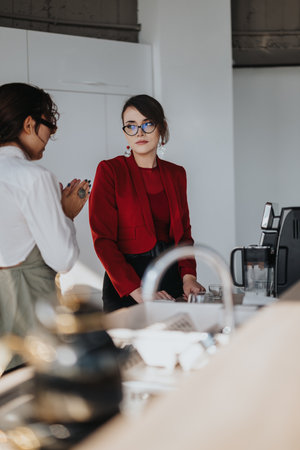 Multiracial business workers having a conversation in a modern officeの写真素材
