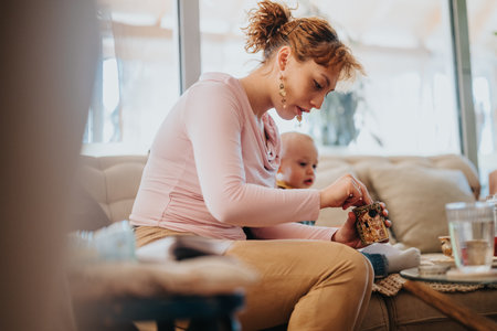 Mother Spending Quality Time with Baby Indoors on a Cozy Dayの写真素材