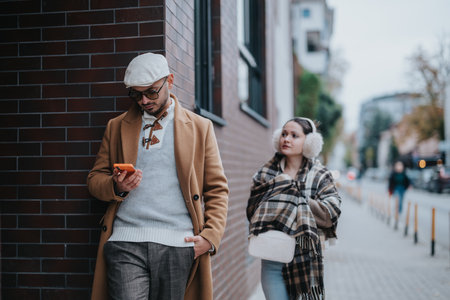 Young couple enjoying a stylish walk in an urban environment outdoorsの写真素材