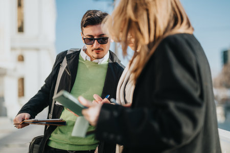 Young people discussing ideas during an outdoor meeting in the city