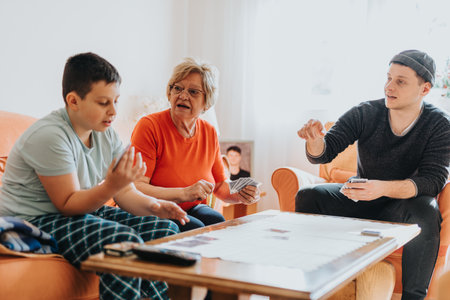 Family members playing a card game together, fostering connection