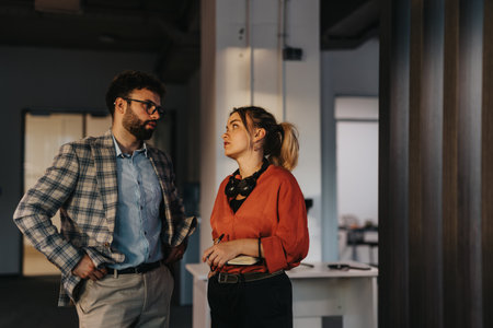 Professional colleagues discussing ideas in an office setting